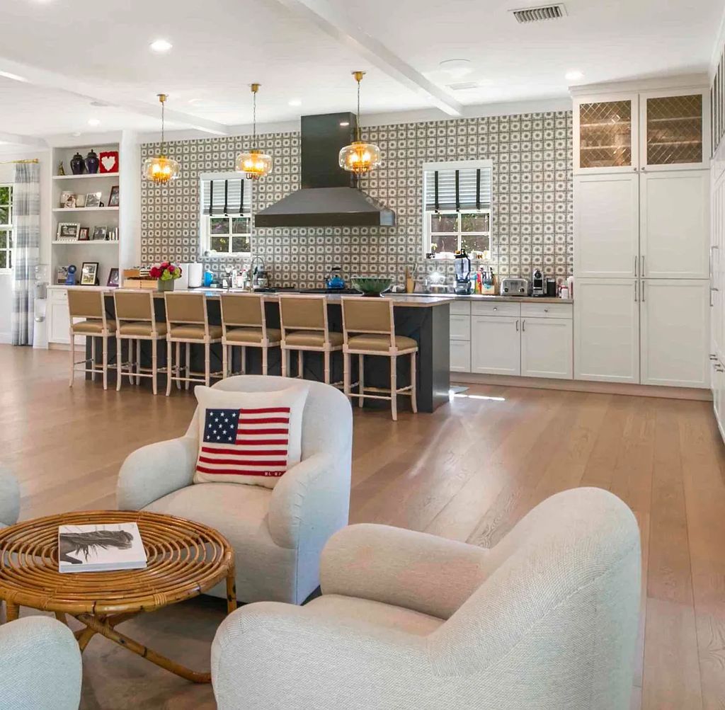 This luxurious 5-bedroom, 6.5-bathroom pool home is located in the Equestrian Club Estates in 14310 Calypso Lane, Wellington, Florida. The house offers 7,173 square feet of living space on a spacious 0.49-acre lot. Built-in 2000, the property has been completely renovated with high-end finishes throughout.