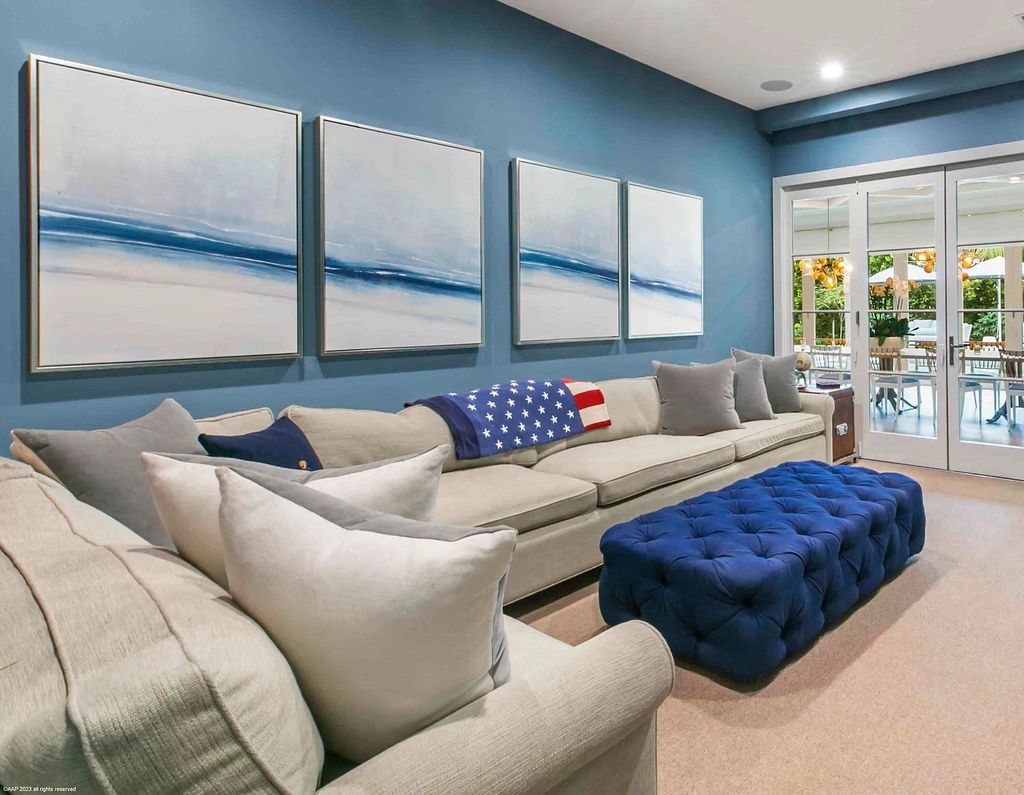 This luxurious 5-bedroom, 6.5-bathroom pool home is located in the Equestrian Club Estates in 14310 Calypso Lane, Wellington, Florida. The house offers 7,173 square feet of living space on a spacious 0.49-acre lot. Built-in 2000, the property has been completely renovated with high-end finishes throughout.