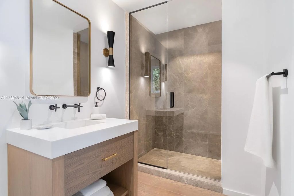 Welcome to 815 E Dilido Drive, Miami Beach, Florida, a stunning transitional home designed by Menin Design. This hme in Miami Beach boasts 6 bedrooms and 8 bathrooms, with a living space of 8,181 square feet, all situated on a spacious 0.31-acre lot. Built in 2006, this home is one of the most impressive properties on the Venetian, offering 107 feet of waterfront living.