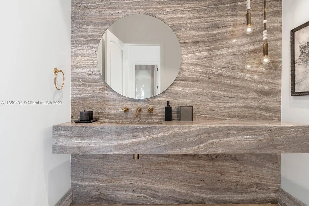 Welcome to 815 E Dilido Drive, Miami Beach, Florida, a stunning transitional home designed by Menin Design. This hme in Miami Beach boasts 6 bedrooms and 8 bathrooms, with a living space of 8,181 square feet, all situated on a spacious 0.31-acre lot. Built in 2006, this home is one of the most impressive properties on the Venetian, offering 107 feet of waterfront living.