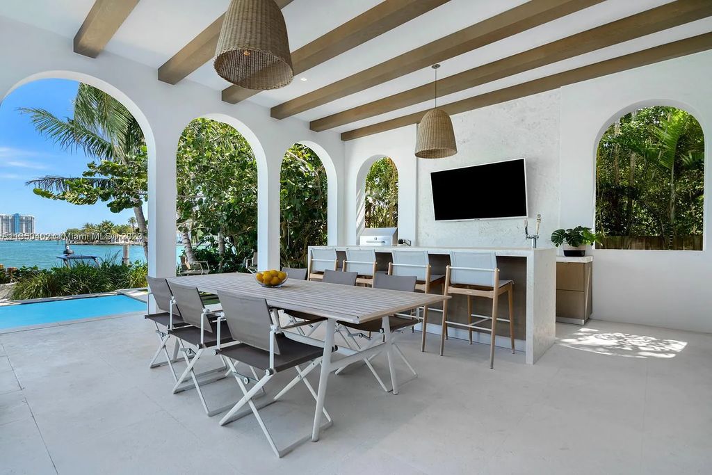 Welcome to 815 E Dilido Drive, Miami Beach, Florida, a stunning transitional home designed by Menin Design. This hme in Miami Beach boasts 6 bedrooms and 8 bathrooms, with a living space of 8,181 square feet, all situated on a spacious 0.31-acre lot. Built in 2006, this home is one of the most impressive properties on the Venetian, offering 107 feet of waterfront living.