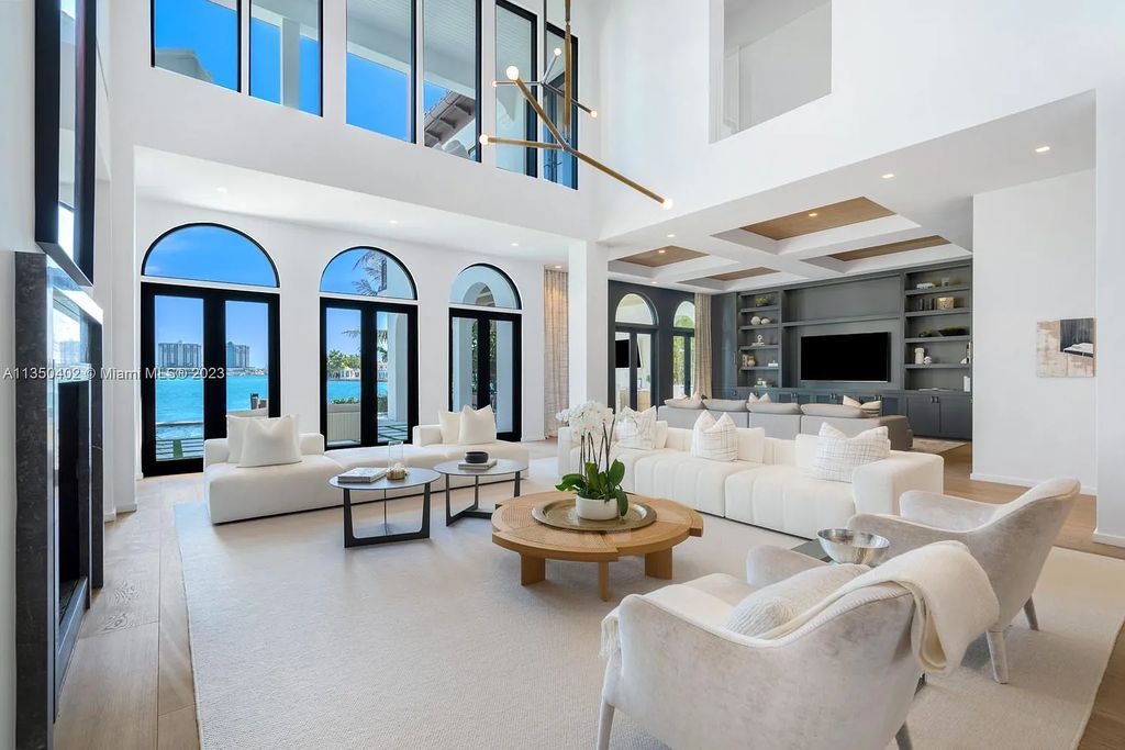 Welcome to 815 E Dilido Drive, Miami Beach, Florida, a stunning transitional home designed by Menin Design. This hme in Miami Beach boasts 6 bedrooms and 8 bathrooms, with a living space of 8,181 square feet, all situated on a spacious 0.31-acre lot. Built in 2006, this home is one of the most impressive properties on the Venetian, offering 107 feet of waterfront living.