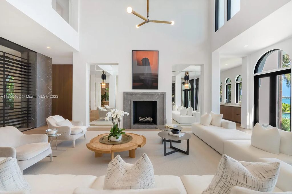 Welcome to 815 E Dilido Drive, Miami Beach, Florida, a stunning transitional home designed by Menin Design. This hme in Miami Beach boasts 6 bedrooms and 8 bathrooms, with a living space of 8,181 square feet, all situated on a spacious 0.31-acre lot. Built in 2006, this home is one of the most impressive properties on the Venetian, offering 107 feet of waterfront living.