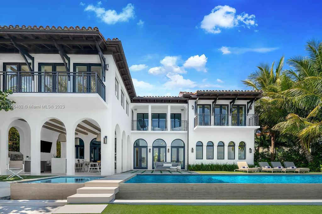 Welcome to 815 E Dilido Drive, Miami Beach, Florida, a stunning transitional home designed by Menin Design. This hme in Miami Beach boasts 6 bedrooms and 8 bathrooms, with a living space of 8,181 square feet, all situated on a spacious 0.31-acre lot. Built in 2006, this home is one of the most impressive properties on the Venetian, offering 107 feet of waterfront living.