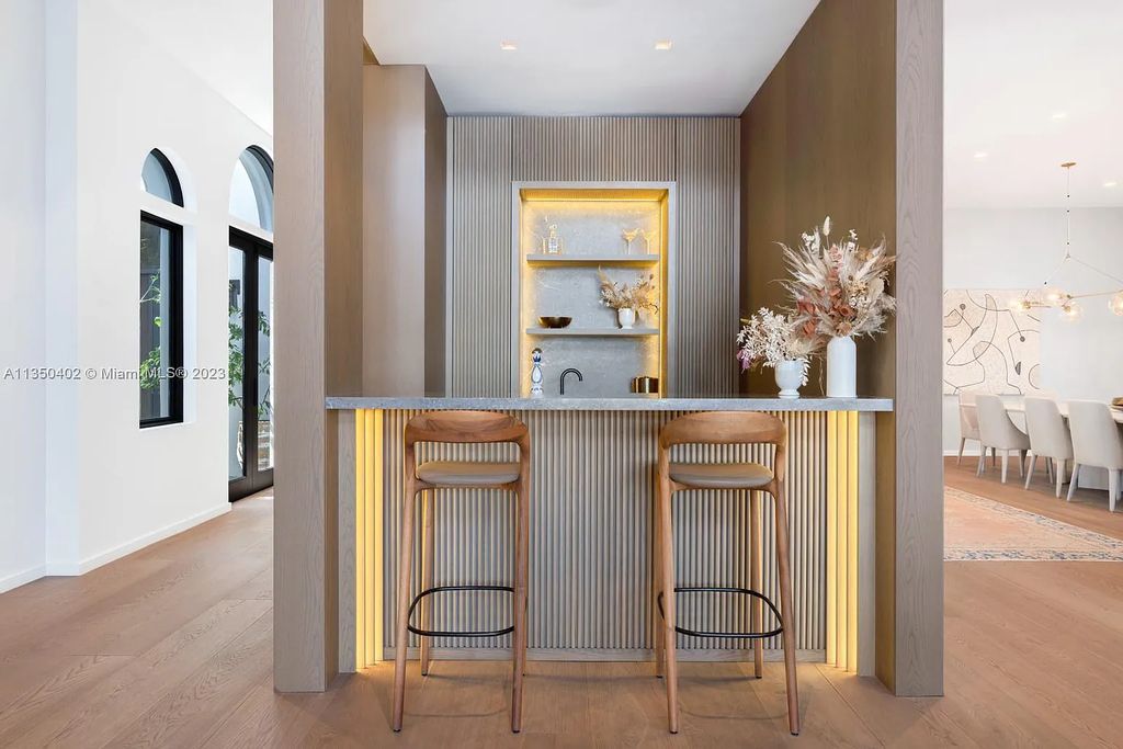 Welcome to 815 E Dilido Drive, Miami Beach, Florida, a stunning transitional home designed by Menin Design. This hme in Miami Beach boasts 6 bedrooms and 8 bathrooms, with a living space of 8,181 square feet, all situated on a spacious 0.31-acre lot. Built in 2006, this home is one of the most impressive properties on the Venetian, offering 107 feet of waterfront living.