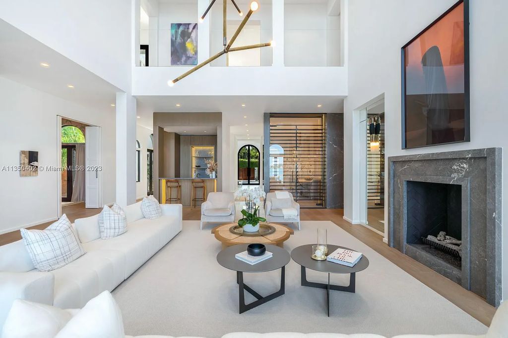 Welcome to 815 E Dilido Drive, Miami Beach, Florida, a stunning transitional home designed by Menin Design. This hme in Miami Beach boasts 6 bedrooms and 8 bathrooms, with a living space of 8,181 square feet, all situated on a spacious 0.31-acre lot. Built in 2006, this home is one of the most impressive properties on the Venetian, offering 107 feet of waterfront living.