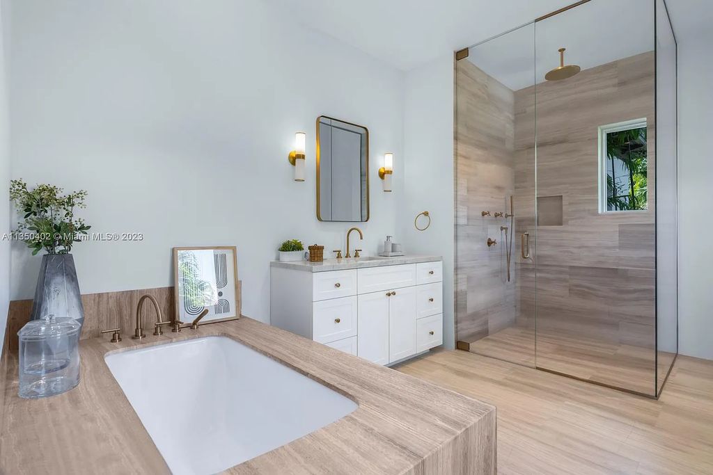 Welcome to 815 E Dilido Drive, Miami Beach, Florida, a stunning transitional home designed by Menin Design. This hme in Miami Beach boasts 6 bedrooms and 8 bathrooms, with a living space of 8,181 square feet, all situated on a spacious 0.31-acre lot. Built in 2006, this home is one of the most impressive properties on the Venetian, offering 107 feet of waterfront living.