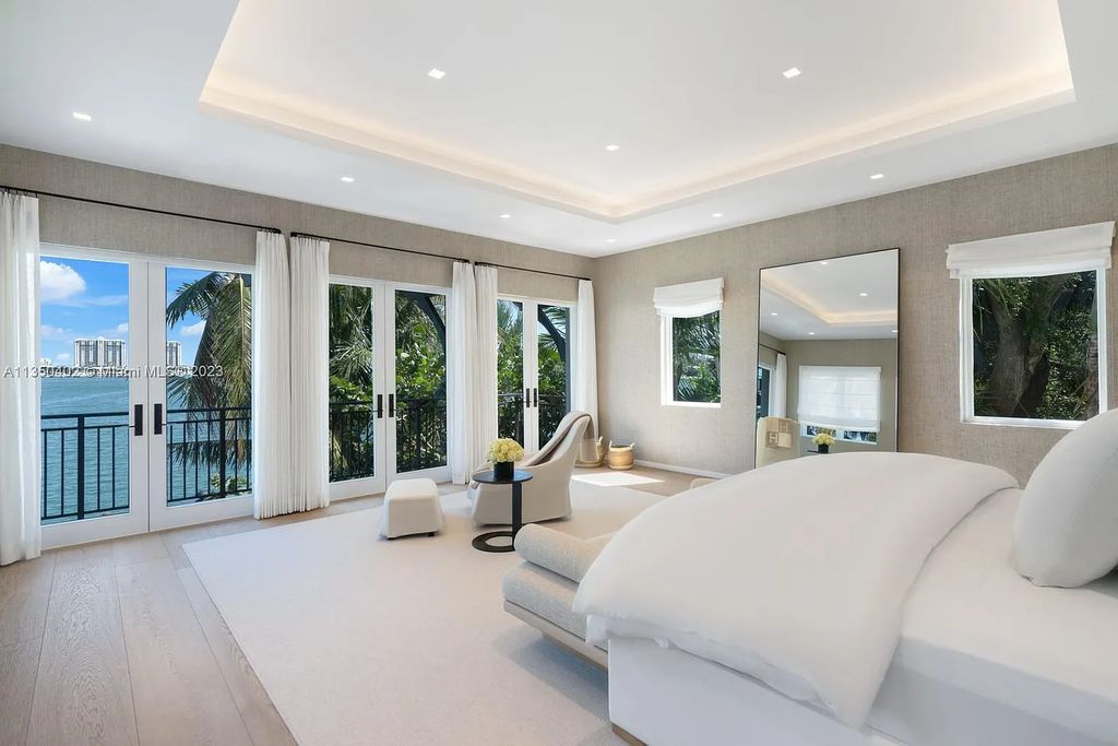 Welcome to 815 E Dilido Drive, Miami Beach, Florida, a stunning transitional home designed by Menin Design. This hme in Miami Beach boasts 6 bedrooms and 8 bathrooms, with a living space of 8,181 square feet, all situated on a spacious 0.31-acre lot. Built in 2006, this home is one of the most impressive properties on the Venetian, offering 107 feet of waterfront living.