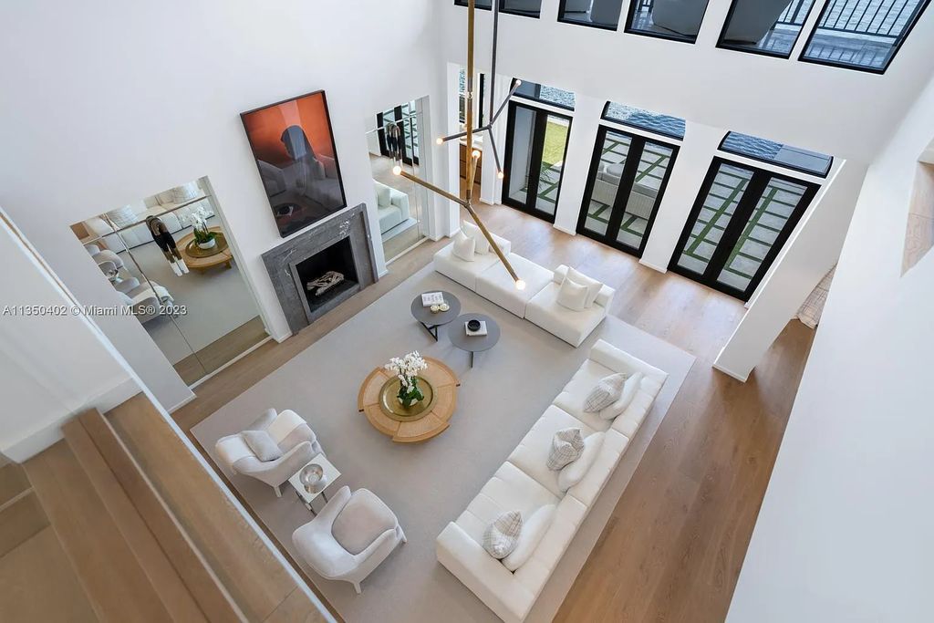 Welcome to 815 E Dilido Drive, Miami Beach, Florida, a stunning transitional home designed by Menin Design. This hme in Miami Beach boasts 6 bedrooms and 8 bathrooms, with a living space of 8,181 square feet, all situated on a spacious 0.31-acre lot. Built in 2006, this home is one of the most impressive properties on the Venetian, offering 107 feet of waterfront living.