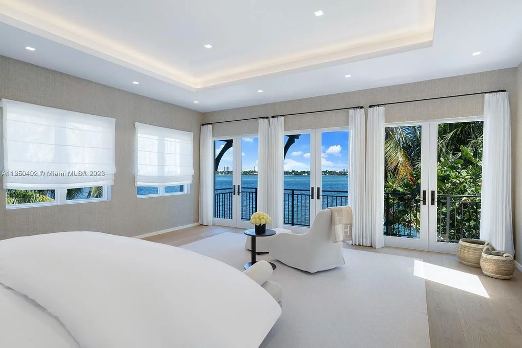 Welcome to 815 E Dilido Drive, Miami Beach, Florida, a stunning transitional home designed by Menin Design. This hme in Miami Beach boasts 6 bedrooms and 8 bathrooms, with a living space of 8,181 square feet, all situated on a spacious 0.31-acre lot. Built in 2006, this home is one of the most impressive properties on the Venetian, offering 107 feet of waterfront living.