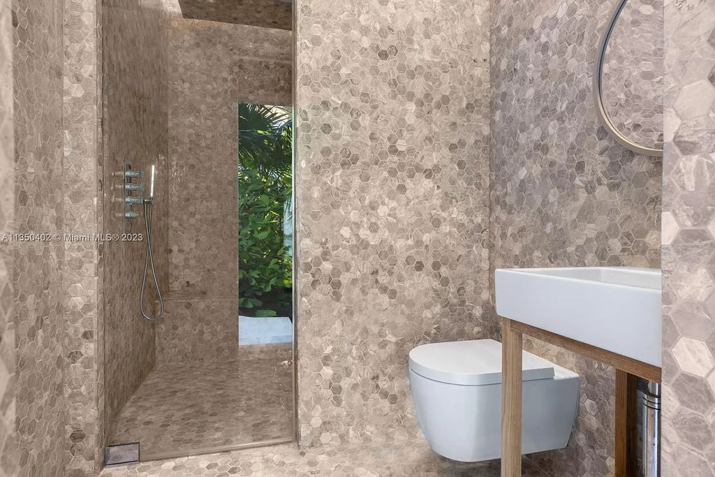 Welcome to 815 E Dilido Drive, Miami Beach, Florida, a stunning transitional home designed by Menin Design. This hme in Miami Beach boasts 6 bedrooms and 8 bathrooms, with a living space of 8,181 square feet, all situated on a spacious 0.31-acre lot. Built in 2006, this home is one of the most impressive properties on the Venetian, offering 107 feet of waterfront living.
