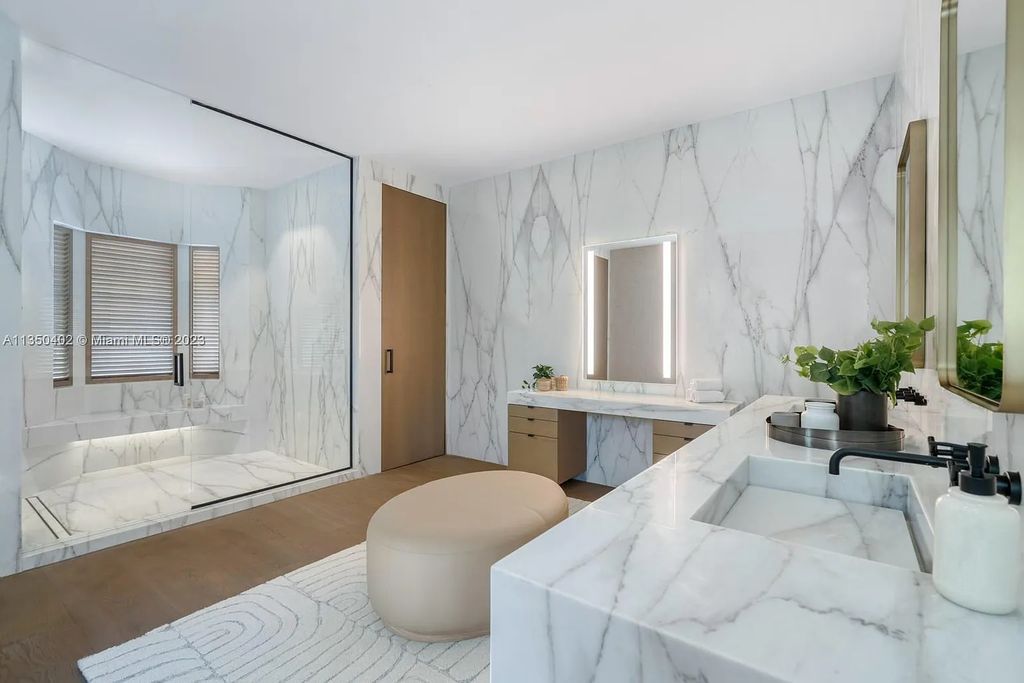 Welcome to 815 E Dilido Drive, Miami Beach, Florida, a stunning transitional home designed by Menin Design. This hme in Miami Beach boasts 6 bedrooms and 8 bathrooms, with a living space of 8,181 square feet, all situated on a spacious 0.31-acre lot. Built in 2006, this home is one of the most impressive properties on the Venetian, offering 107 feet of waterfront living.