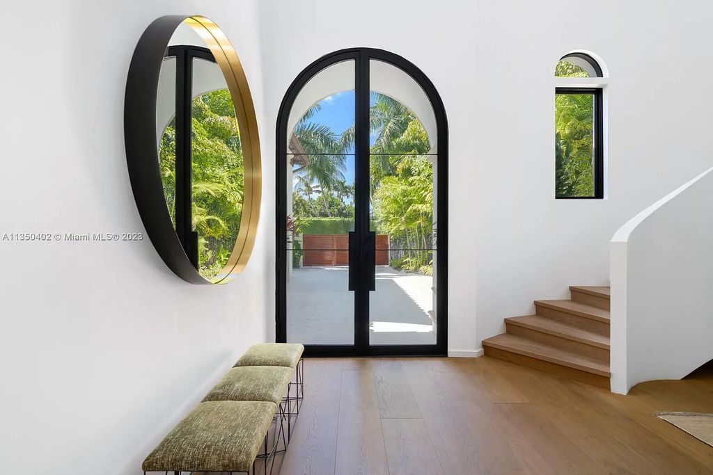 Welcome to 815 E Dilido Drive, Miami Beach, Florida, a stunning transitional home designed by Menin Design. This hme in Miami Beach boasts 6 bedrooms and 8 bathrooms, with a living space of 8,181 square feet, all situated on a spacious 0.31-acre lot. Built in 2006, this home is one of the most impressive properties on the Venetian, offering 107 feet of waterfront living.