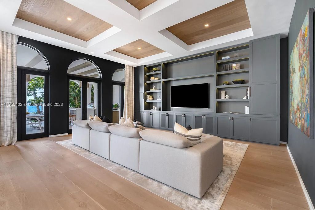 Welcome to 815 E Dilido Drive, Miami Beach, Florida, a stunning transitional home designed by Menin Design. This hme in Miami Beach boasts 6 bedrooms and 8 bathrooms, with a living space of 8,181 square feet, all situated on a spacious 0.31-acre lot. Built in 2006, this home is one of the most impressive properties on the Venetian, offering 107 feet of waterfront living.