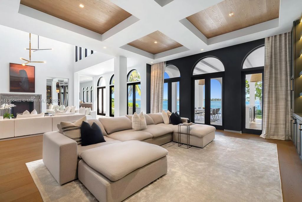 Welcome to 815 E Dilido Drive, Miami Beach, Florida, a stunning transitional home designed by Menin Design. This hme in Miami Beach boasts 6 bedrooms and 8 bathrooms, with a living space of 8,181 square feet, all situated on a spacious 0.31-acre lot. Built in 2006, this home is one of the most impressive properties on the Venetian, offering 107 feet of waterfront living.