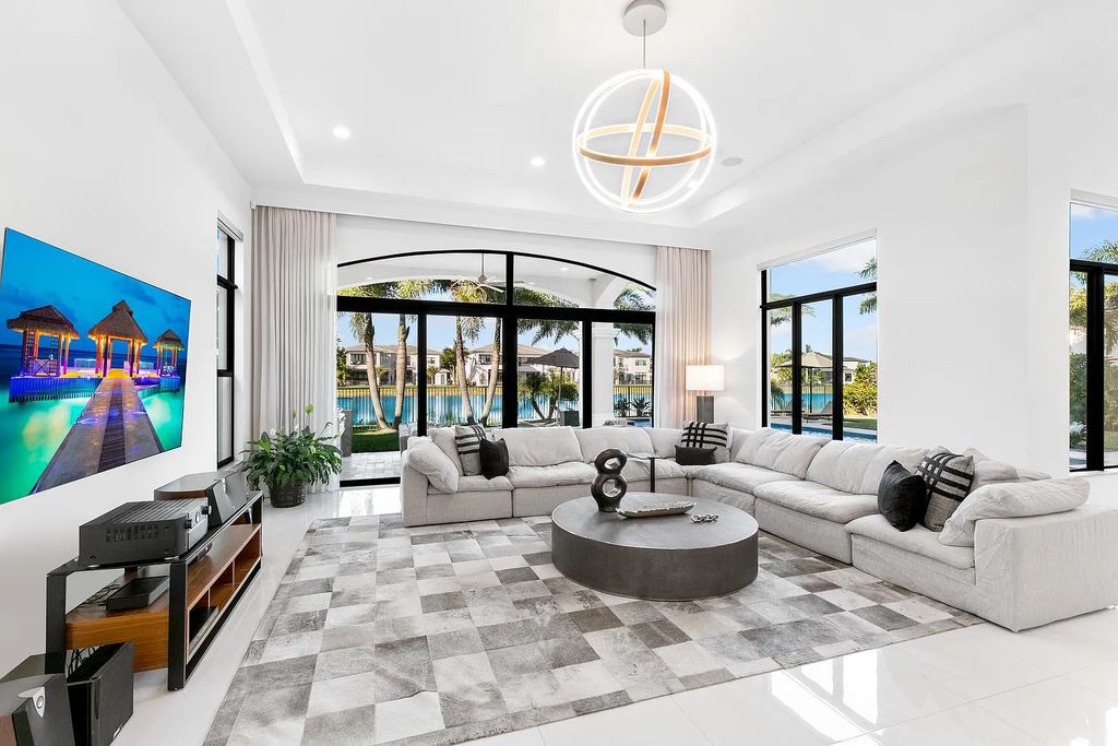 This 6-bedroom, 8-bathroom palazzo estate is located at 17206 Brulee Breeze Way, Boca Raton, Florida, and boasts 7,732 square feet of luxurious living space. The house is designed to offer clean lines, sophisticated design, and stunning finishes, with each space masterfully curated for luxurious living and gracious entertaining.