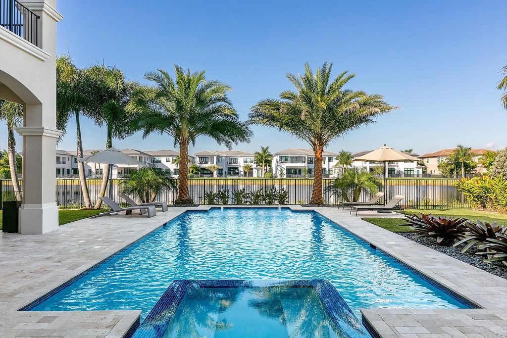 This 6-bedroom, 8-bathroom palazzo estate is located at 17206 Brulee Breeze Way, Boca Raton, Florida, and boasts 7,732 square feet of luxurious living space. The house is designed to offer clean lines, sophisticated design, and stunning finishes, with each space masterfully curated for luxurious living and gracious entertaining.