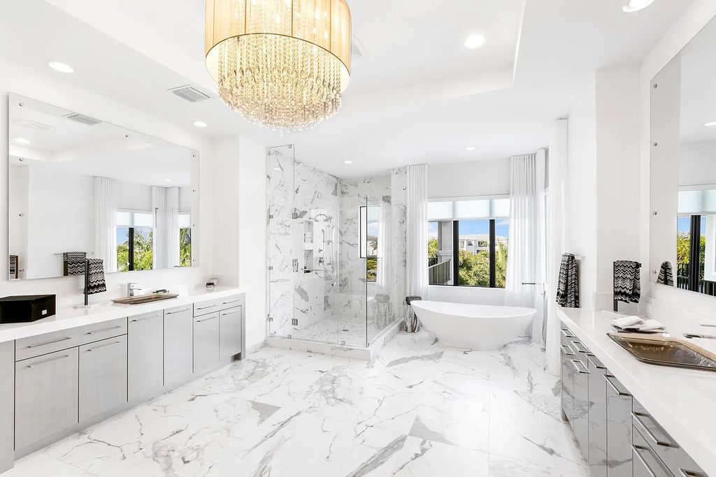 This 6-bedroom, 8-bathroom palazzo estate is located at 17206 Brulee Breeze Way, Boca Raton, Florida, and boasts 7,732 square feet of luxurious living space. The house is designed to offer clean lines, sophisticated design, and stunning finishes, with each space masterfully curated for luxurious living and gracious entertaining.