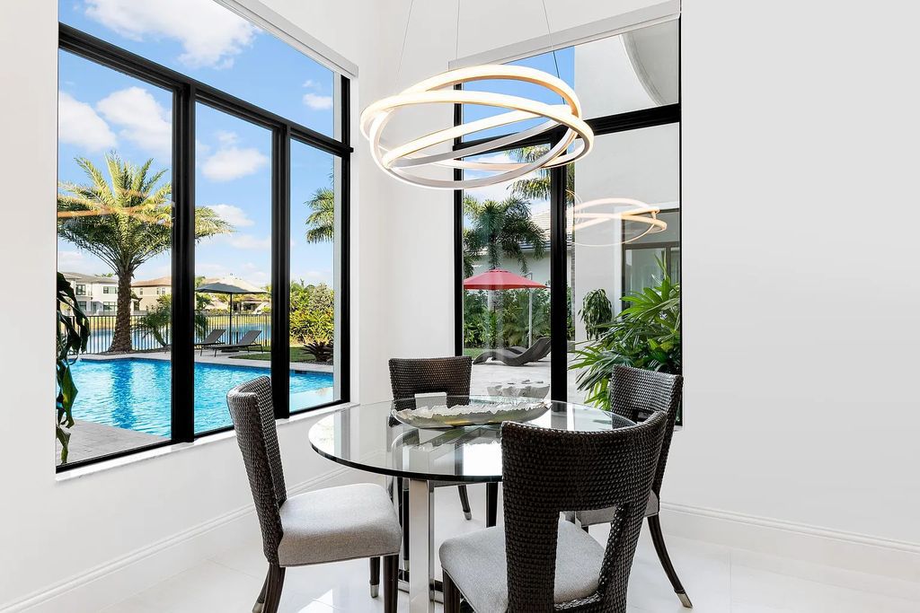 This 6-bedroom, 8-bathroom palazzo estate is located at 17206 Brulee Breeze Way, Boca Raton, Florida, and boasts 7,732 square feet of luxurious living space. The house is designed to offer clean lines, sophisticated design, and stunning finishes, with each space masterfully curated for luxurious living and gracious entertaining.