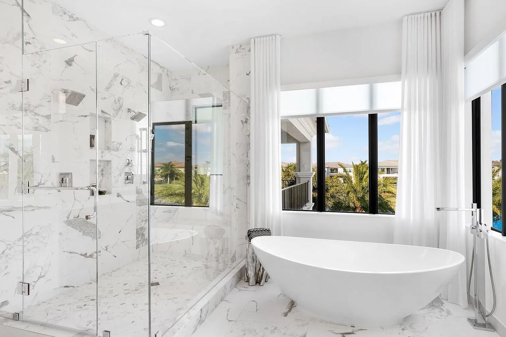 This 6-bedroom, 8-bathroom palazzo estate is located at 17206 Brulee Breeze Way, Boca Raton, Florida, and boasts 7,732 square feet of luxurious living space. The house is designed to offer clean lines, sophisticated design, and stunning finishes, with each space masterfully curated for luxurious living and gracious entertaining.