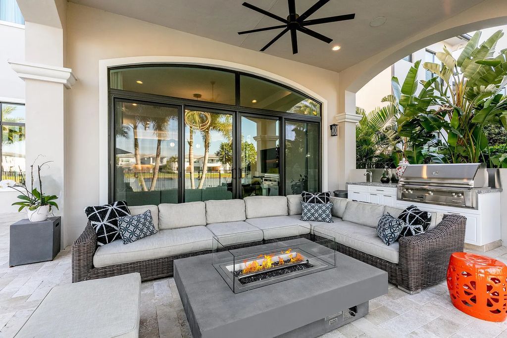 This 6-bedroom, 8-bathroom palazzo estate is located at 17206 Brulee Breeze Way, Boca Raton, Florida, and boasts 7,732 square feet of luxurious living space. The house is designed to offer clean lines, sophisticated design, and stunning finishes, with each space masterfully curated for luxurious living and gracious entertaining.