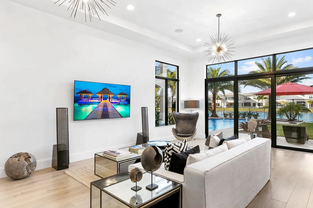 This 6-bedroom, 8-bathroom palazzo estate is located at 17206 Brulee Breeze Way, Boca Raton, Florida, and boasts 7,732 square feet of luxurious living space. The house is designed to offer clean lines, sophisticated design, and stunning finishes, with each space masterfully curated for luxurious living and gracious entertaining.