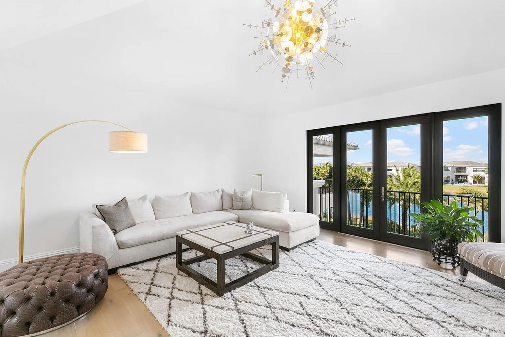 This 6-bedroom, 8-bathroom palazzo estate is located at 17206 Brulee Breeze Way, Boca Raton, Florida, and boasts 7,732 square feet of luxurious living space. The house is designed to offer clean lines, sophisticated design, and stunning finishes, with each space masterfully curated for luxurious living and gracious entertaining.