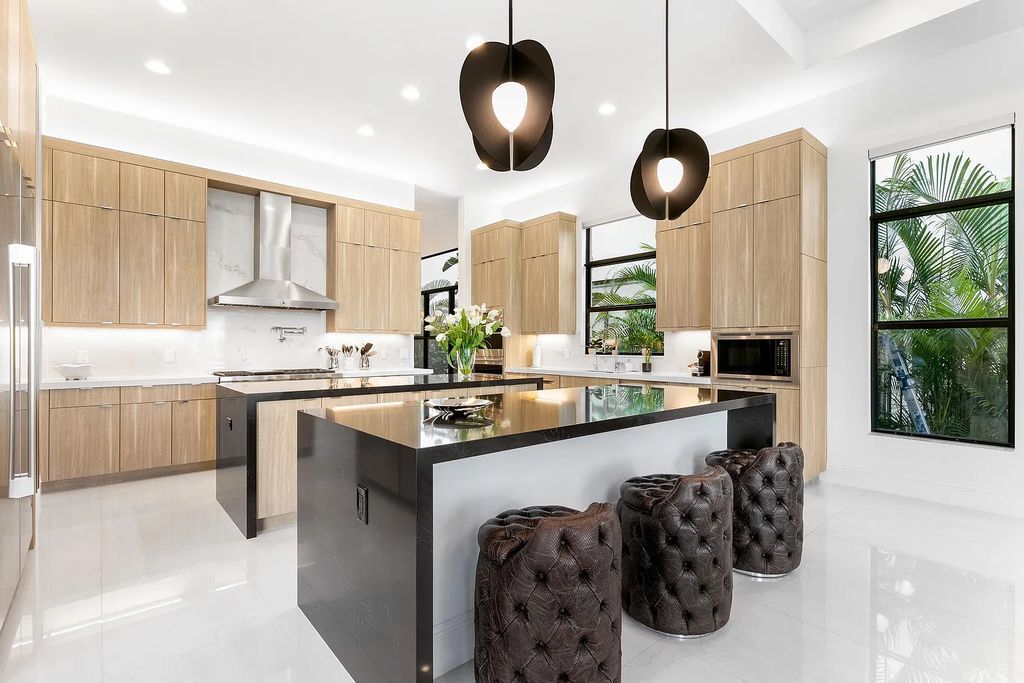 This 6-bedroom, 8-bathroom palazzo estate is located at 17206 Brulee Breeze Way, Boca Raton, Florida, and boasts 7,732 square feet of luxurious living space. The house is designed to offer clean lines, sophisticated design, and stunning finishes, with each space masterfully curated for luxurious living and gracious entertaining.