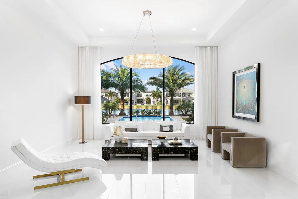 This 6-bedroom, 8-bathroom palazzo estate is located at 17206 Brulee Breeze Way, Boca Raton, Florida, and boasts 7,732 square feet of luxurious living space. The house is designed to offer clean lines, sophisticated design, and stunning finishes, with each space masterfully curated for luxurious living and gracious entertaining.