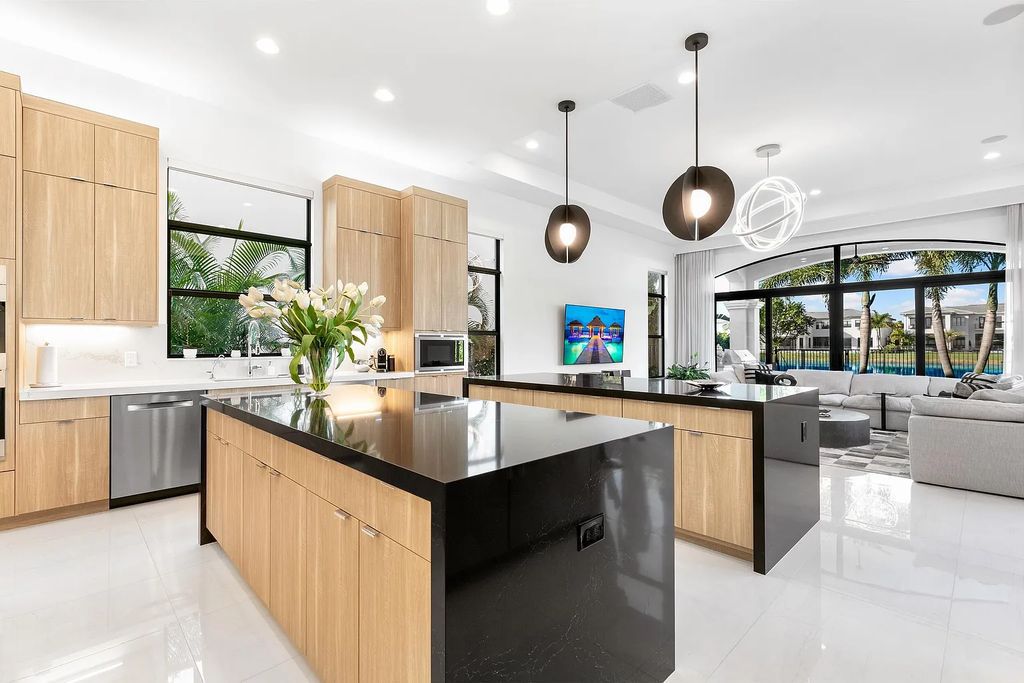 This 6-bedroom, 8-bathroom palazzo estate is located at 17206 Brulee Breeze Way, Boca Raton, Florida, and boasts 7,732 square feet of luxurious living space. The house is designed to offer clean lines, sophisticated design, and stunning finishes, with each space masterfully curated for luxurious living and gracious entertaining.