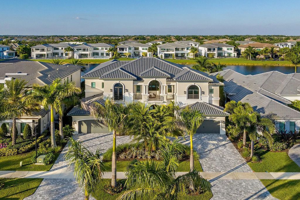 This 6-bedroom, 8-bathroom palazzo estate is located at 17206 Brulee Breeze Way, Boca Raton, Florida, and boasts 7,732 square feet of luxurious living space. The house is designed to offer clean lines, sophisticated design, and stunning finishes, with each space masterfully curated for luxurious living and gracious entertaining.