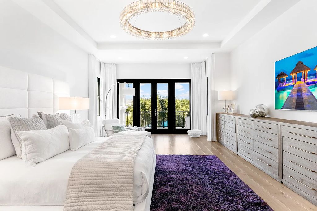This 6-bedroom, 8-bathroom palazzo estate is located at 17206 Brulee Breeze Way, Boca Raton, Florida, and boasts 7,732 square feet of luxurious living space. The house is designed to offer clean lines, sophisticated design, and stunning finishes, with each space masterfully curated for luxurious living and gracious entertaining.