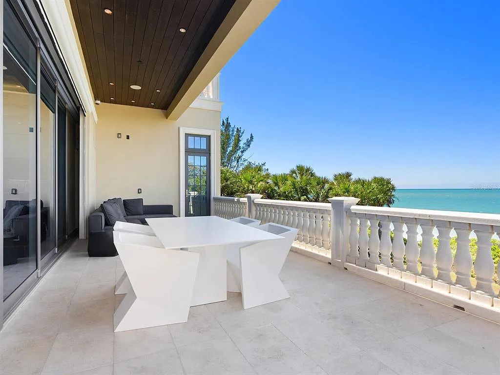 This stunning 2018-built gulf front estate is located at 3909 Casey Key Road in Nokomis, Florida. Boasting 4 bedrooms, 6 bathrooms, and a sprawling living space of 6,335 square feet on a 0.53-acre lot, this refined and elegant home offers breathtaking views of the Gulf of Mexico from the expansive walls of glass.