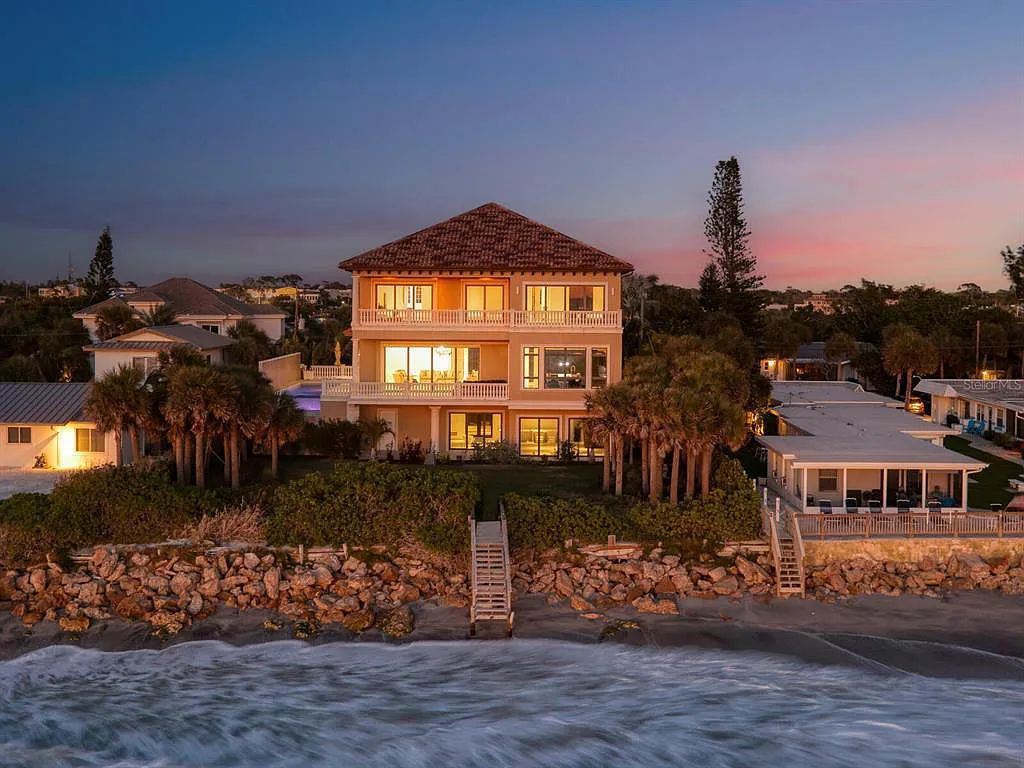 This stunning 2018-built gulf front estate is located at 3909 Casey Key Road in Nokomis, Florida. Boasting 4 bedrooms, 6 bathrooms, and a sprawling living space of 6,335 square feet on a 0.53-acre lot, this refined and elegant home offers breathtaking views of the Gulf of Mexico from the expansive walls of glass.