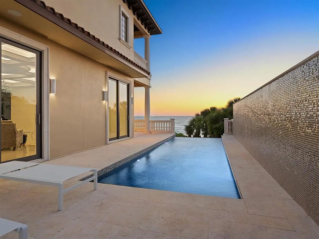 This stunning 2018-built gulf front estate is located at 3909 Casey Key Road in Nokomis, Florida. Boasting 4 bedrooms, 6 bathrooms, and a sprawling living space of 6,335 square feet on a 0.53-acre lot, this refined and elegant home offers breathtaking views of the Gulf of Mexico from the expansive walls of glass.
