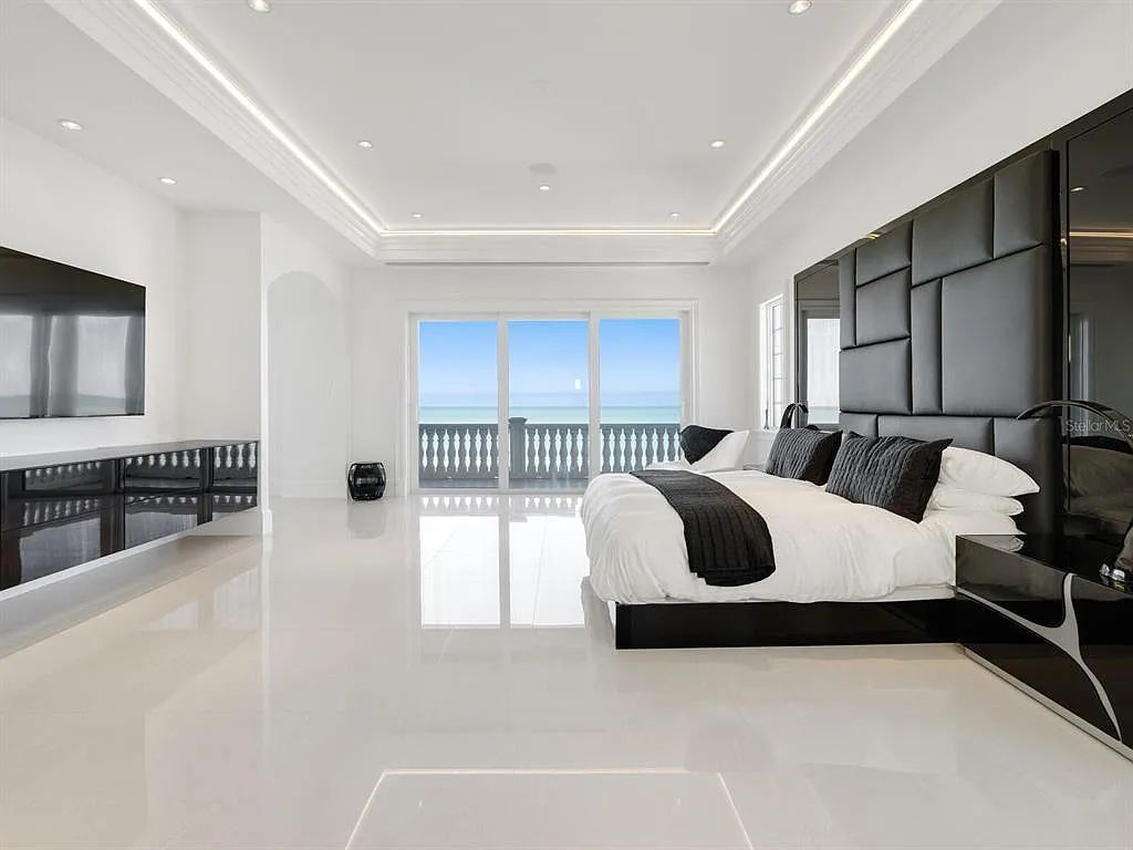 This stunning 2018-built gulf front estate is located at 3909 Casey Key Road in Nokomis, Florida. Boasting 4 bedrooms, 6 bathrooms, and a sprawling living space of 6,335 square feet on a 0.53-acre lot, this refined and elegant home offers breathtaking views of the Gulf of Mexico from the expansive walls of glass.