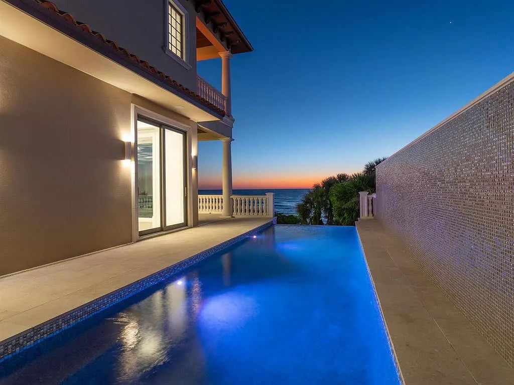 This stunning 2018-built gulf front estate is located at 3909 Casey Key Road in Nokomis, Florida. Boasting 4 bedrooms, 6 bathrooms, and a sprawling living space of 6,335 square feet on a 0.53-acre lot, this refined and elegant home offers breathtaking views of the Gulf of Mexico from the expansive walls of glass.