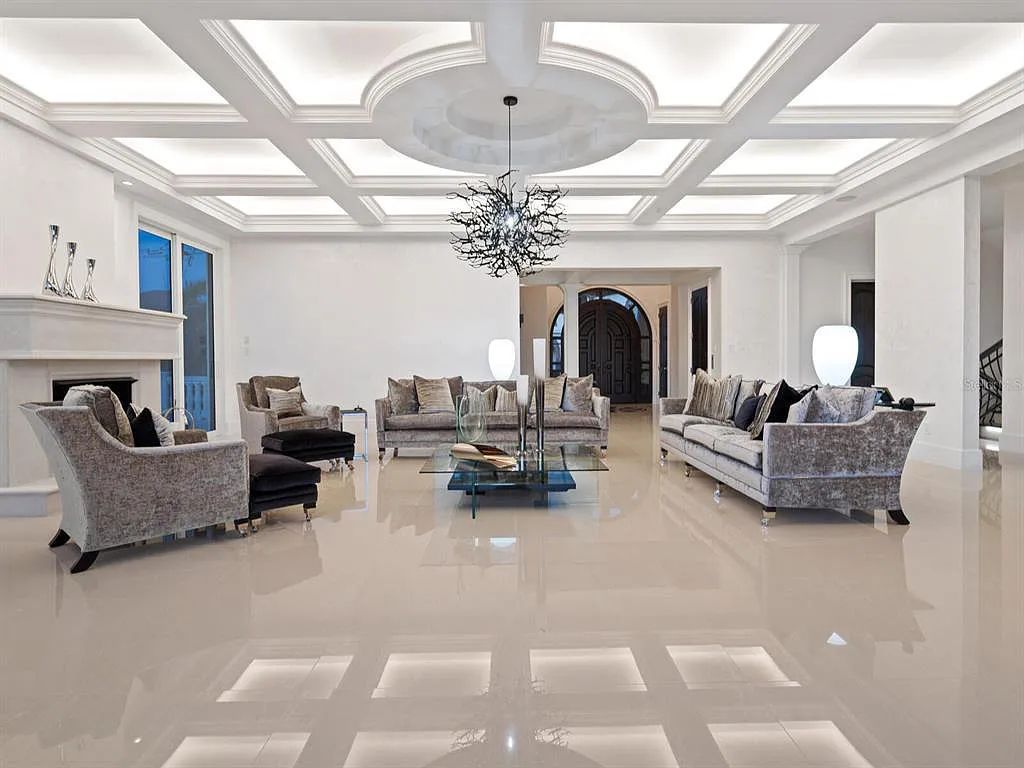 This stunning 2018-built gulf front estate is located at 3909 Casey Key Road in Nokomis, Florida. Boasting 4 bedrooms, 6 bathrooms, and a sprawling living space of 6,335 square feet on a 0.53-acre lot, this refined and elegant home offers breathtaking views of the Gulf of Mexico from the expansive walls of glass.