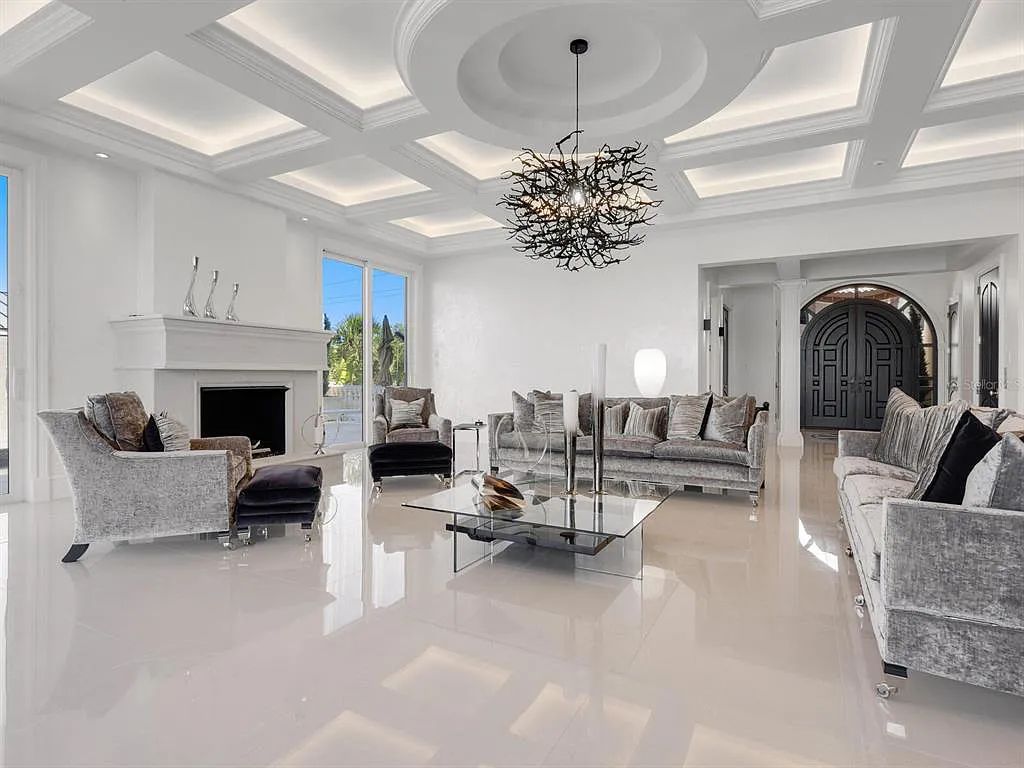 This stunning 2018-built gulf front estate is located at 3909 Casey Key Road in Nokomis, Florida. Boasting 4 bedrooms, 6 bathrooms, and a sprawling living space of 6,335 square feet on a 0.53-acre lot, this refined and elegant home offers breathtaking views of the Gulf of Mexico from the expansive walls of glass.