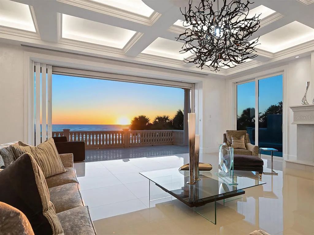 This stunning 2018-built gulf front estate is located at 3909 Casey Key Road in Nokomis, Florida. Boasting 4 bedrooms, 6 bathrooms, and a sprawling living space of 6,335 square feet on a 0.53-acre lot, this refined and elegant home offers breathtaking views of the Gulf of Mexico from the expansive walls of glass.