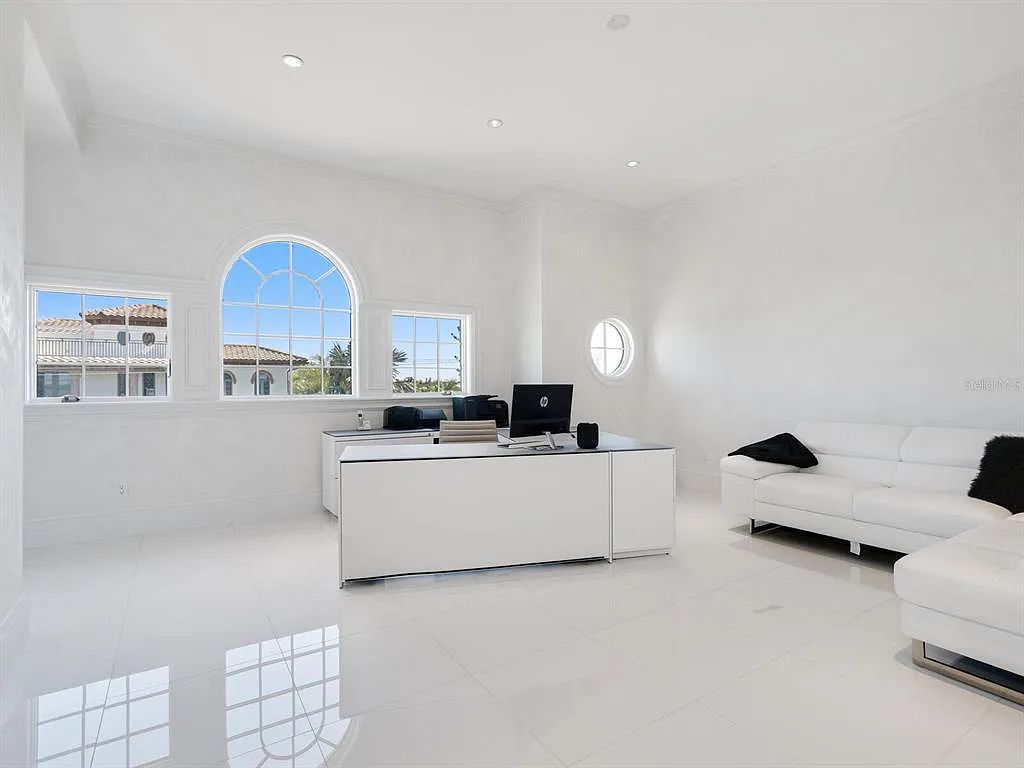 This stunning 2018-built gulf front estate is located at 3909 Casey Key Road in Nokomis, Florida. Boasting 4 bedrooms, 6 bathrooms, and a sprawling living space of 6,335 square feet on a 0.53-acre lot, this refined and elegant home offers breathtaking views of the Gulf of Mexico from the expansive walls of glass.