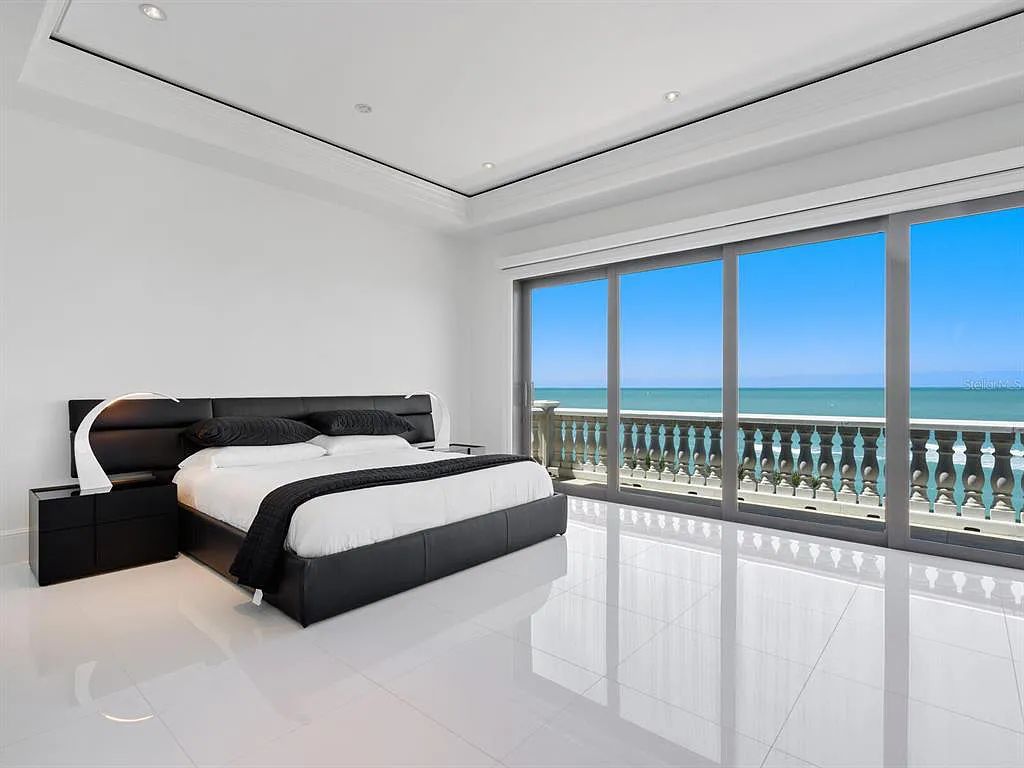 This stunning 2018-built gulf front estate is located at 3909 Casey Key Road in Nokomis, Florida. Boasting 4 bedrooms, 6 bathrooms, and a sprawling living space of 6,335 square feet on a 0.53-acre lot, this refined and elegant home offers breathtaking views of the Gulf of Mexico from the expansive walls of glass.
