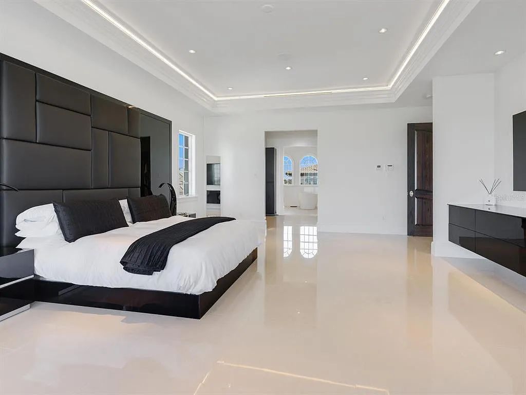 This stunning 2018-built gulf front estate is located at 3909 Casey Key Road in Nokomis, Florida. Boasting 4 bedrooms, 6 bathrooms, and a sprawling living space of 6,335 square feet on a 0.53-acre lot, this refined and elegant home offers breathtaking views of the Gulf of Mexico from the expansive walls of glass.