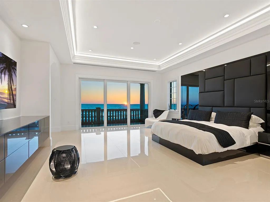This stunning 2018-built gulf front estate is located at 3909 Casey Key Road in Nokomis, Florida. Boasting 4 bedrooms, 6 bathrooms, and a sprawling living space of 6,335 square feet on a 0.53-acre lot, this refined and elegant home offers breathtaking views of the Gulf of Mexico from the expansive walls of glass.