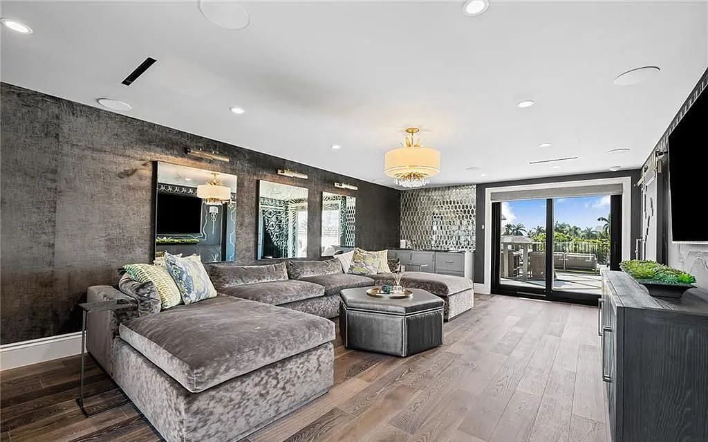 Welcome to 633 Isle of Palms Drive in Fort Lauderdale, Florida, where luxury living meets bespoke grandeur. This custom-built residence features 5 bedrooms, 8 bathrooms, and 7,970 square feet of living space on a 0.30-acre lot with a 100-foot dock, 21K lift, and a resort-like salt pool and spa.