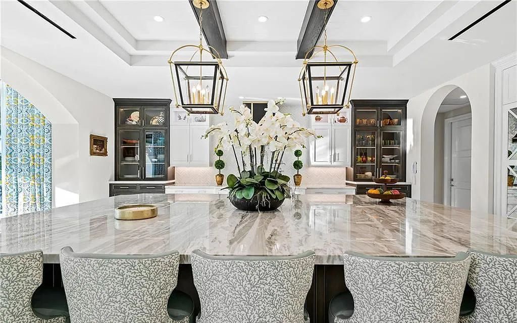 Welcome to 633 Isle of Palms Drive in Fort Lauderdale, Florida, where luxury living meets bespoke grandeur. This custom-built residence features 5 bedrooms, 8 bathrooms, and 7,970 square feet of living space on a 0.30-acre lot with a 100-foot dock, 21K lift, and a resort-like salt pool and spa.
