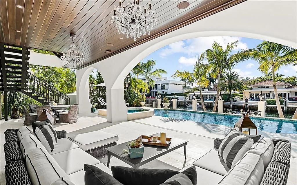 Welcome to 633 Isle of Palms Drive in Fort Lauderdale, Florida, where luxury living meets bespoke grandeur. This custom-built residence features 5 bedrooms, 8 bathrooms, and 7,970 square feet of living space on a 0.30-acre lot with a 100-foot dock, 21K lift, and a resort-like salt pool and spa.