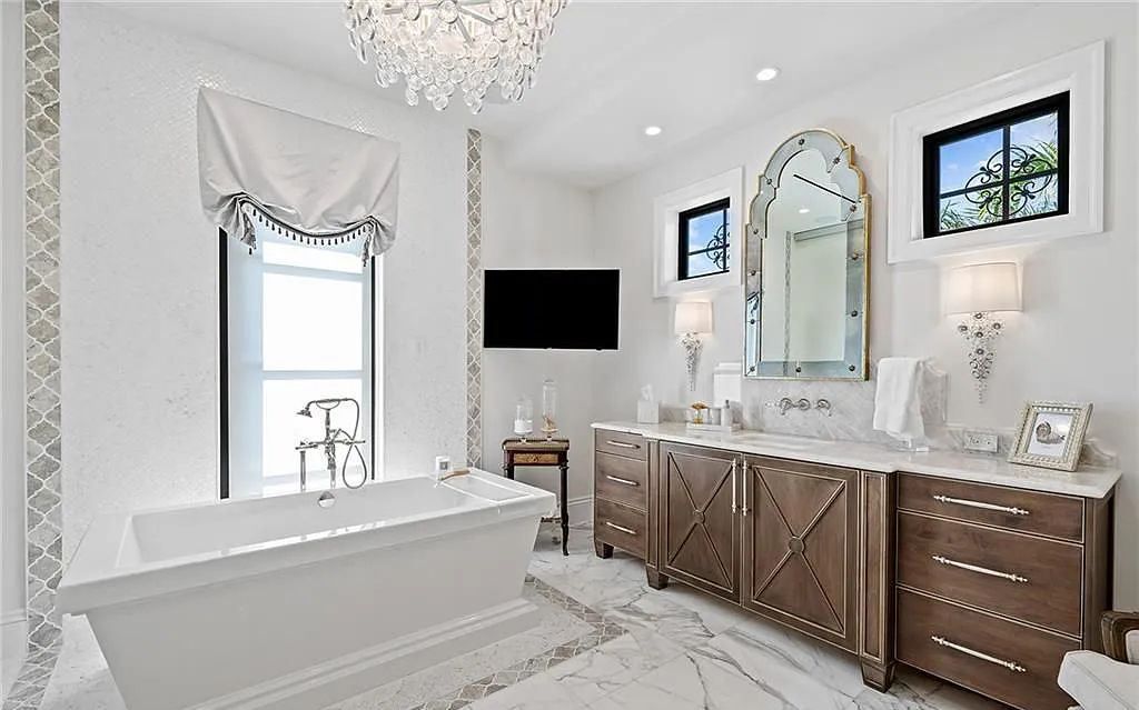 Welcome to 633 Isle of Palms Drive in Fort Lauderdale, Florida, where luxury living meets bespoke grandeur. This custom-built residence features 5 bedrooms, 8 bathrooms, and 7,970 square feet of living space on a 0.30-acre lot with a 100-foot dock, 21K lift, and a resort-like salt pool and spa.