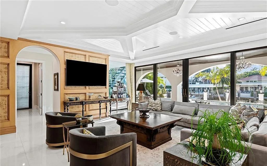 Welcome to 633 Isle of Palms Drive in Fort Lauderdale, Florida, where luxury living meets bespoke grandeur. This custom-built residence features 5 bedrooms, 8 bathrooms, and 7,970 square feet of living space on a 0.30-acre lot with a 100-foot dock, 21K lift, and a resort-like salt pool and spa.