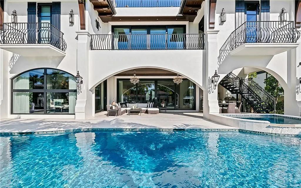 Welcome to 633 Isle of Palms Drive in Fort Lauderdale, Florida, where luxury living meets bespoke grandeur. This custom-built residence features 5 bedrooms, 8 bathrooms, and 7,970 square feet of living space on a 0.30-acre lot with a 100-foot dock, 21K lift, and a resort-like salt pool and spa.
